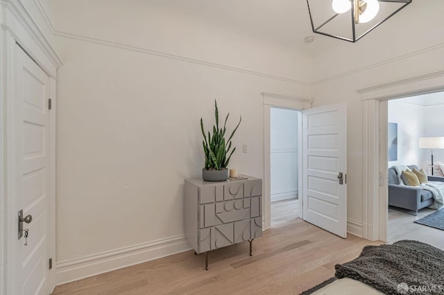 bedroom featuring baseboards and light wood-type flooring