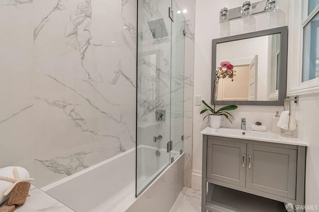 bathroom with marble finish floor, vanity, and shower / bath combination with glass door