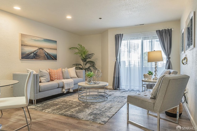 1396 El Camino Real Unit 110, Millbrae, CA 94030 - living area with wood finished floors and recessed lighting