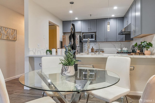 1396 El Camino Real Unit 110, Millbrae, CA 94030 - dining space with wood finished floors, recessed lighting, and a textured wall