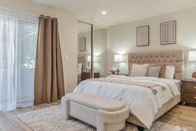1396 El Camino Real Unit 110, Millbrae, CA 94030 - bedroom featuring light wood-style flooring, a closet, and recessed lighting