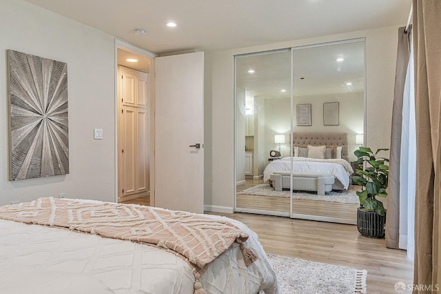 1396 El Camino Real Unit 110, Millbrae, CA 94030 - bedroom with light wood-style flooring, a closet, and recessed lighting