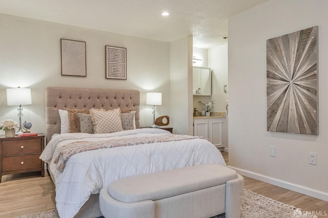 1396 El Camino Real Unit 110, Millbrae, CA 94030 - bedroom featuring light wood-style flooring, ensuite bath, and recessed lighting