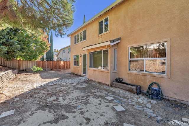 rear view of house with a patio area