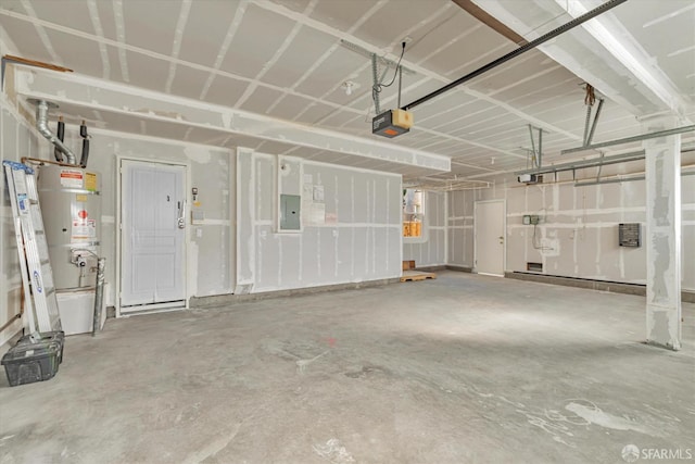 garage featuring water heater, a garage door opener, and electric panel