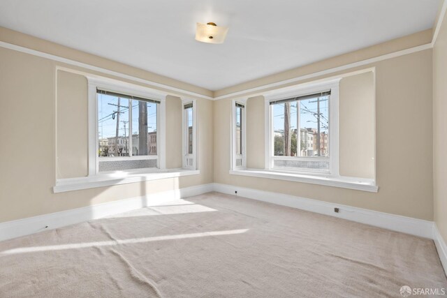 unfurnished room featuring carpet floors