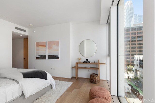 1 Steuart Ln Unit 608, San Francisco, CA 94105 - bedroom with wood finished floors and a view of city