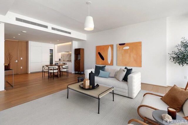 1 Steuart Ln Unit 608, San Francisco, CA 94105 - living area featuring wood finished floors and recessed lighting