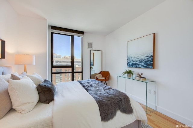 bedroom featuring hardwood / wood-style floors