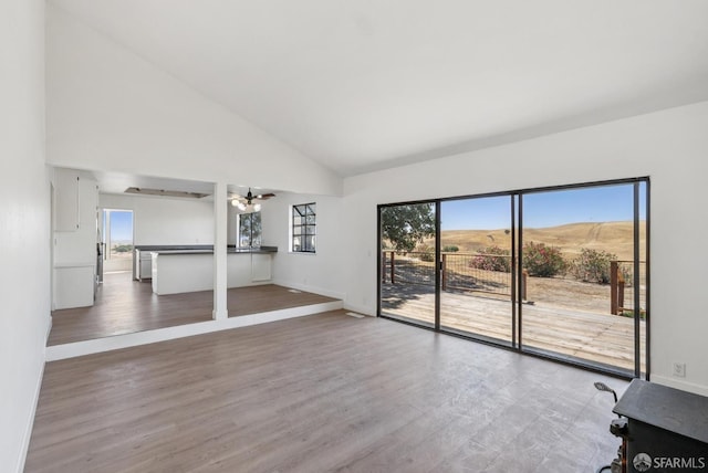 4411 Camino Vaqueros, Brentwood, CA 94513 - unfurnished living room featuring high vaulted ceiling, ceiling fan, and wood finished floors
