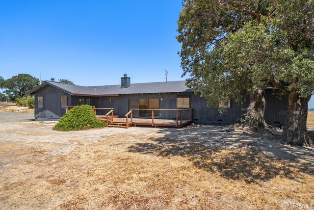 4411 Camino Vaqueros, Brentwood, CA 94513 - rear view of property with a chimney and a wooden deck