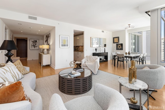 188 Minna St Unit 24A, San Francisco, CA 94105 - living area featuring light wood-style floors, baseboards, and recessed lighting