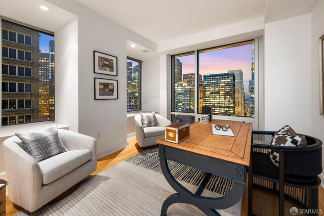 188 Minna St Unit 24A, San Francisco, CA 94105 - home office with a view of city, wood finished floors, recessed lighting, and baseboards