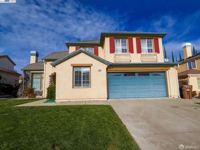 view of property featuring a garage and a front lawn