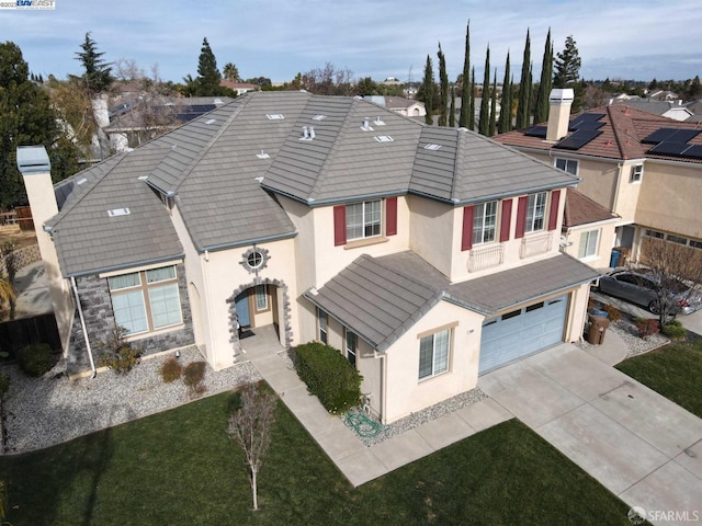 view of front facade with a garage and a front lawn