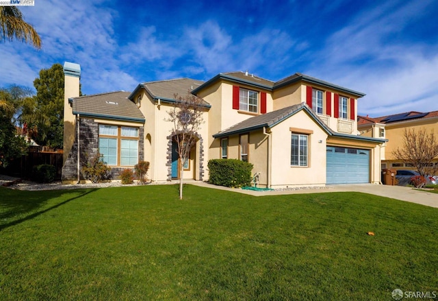 view of front of property featuring a front yard and a garage