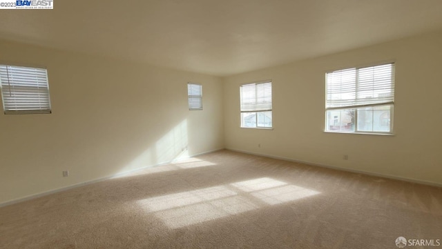 empty room featuring light colored carpet