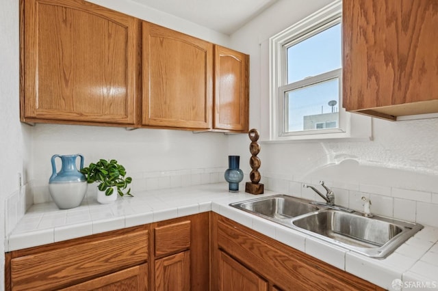 77 Reddy St, San Francisco, CA 94124 - kitchen featuring a sink, light countertops, and brown cabinets