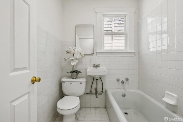 77 Reddy St, San Francisco, CA 94124 - full bath with toilet, a bath, tile patterned floors, tile walls, and a sink