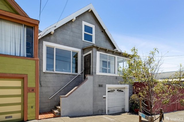 77 Reddy St, San Francisco, CA 94124 - view of front of home with an attached garage and stairs