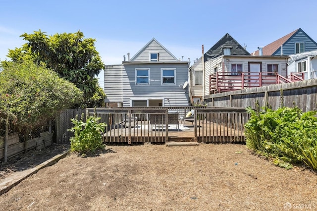 77 Reddy St, San Francisco, CA 94124 - rear view of property featuring a fenced backyard and a wooden deck