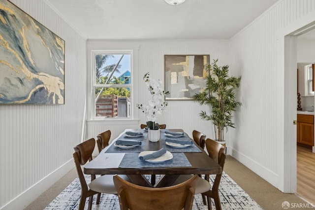 77 Reddy St, San Francisco, CA 94124 - dining area with light colored carpet, ornamental molding, and baseboards