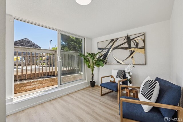 77 Reddy St, San Francisco, CA 94124 - sitting room featuring wood finished floors and baseboards