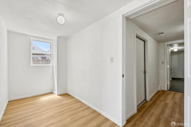 77 Reddy St, San Francisco, CA 94124 - empty room featuring light wood-style floors and baseboards