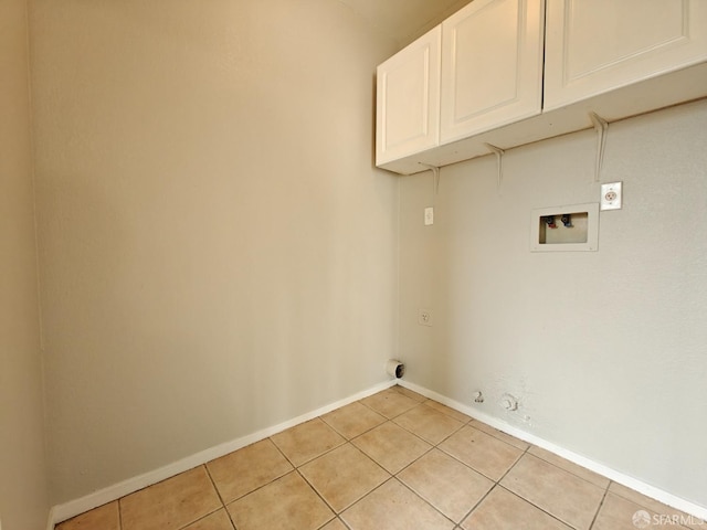 washroom with washer hookup, light tile patterned floors, cabinet space, gas dryer hookup, and electric dryer hookup