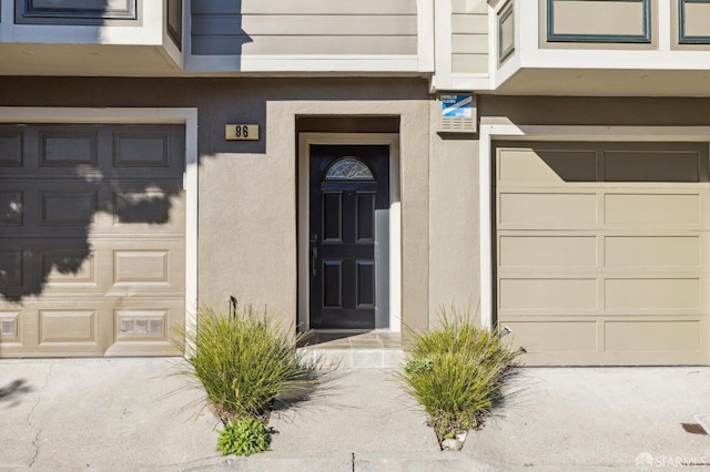 view of exterior entry featuring a garage