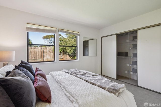 carpeted bedroom featuring a closet