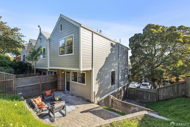 back of house featuring a patio area