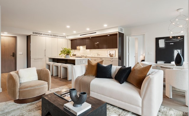 living room with light hardwood / wood-style flooring