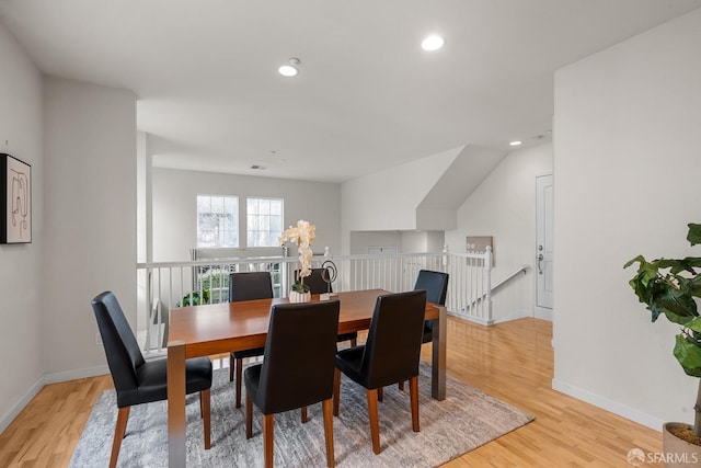 dining space featuring recessed lighting, baseboards, and light wood finished floors