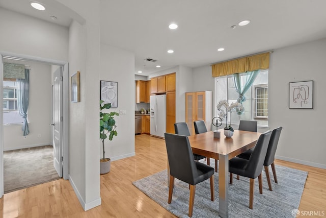 dining room with visible vents, recessed lighting, baseboards, and light wood-style floors