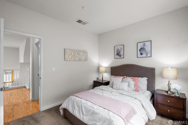 bedroom with visible vents, baseboards, and carpet floors