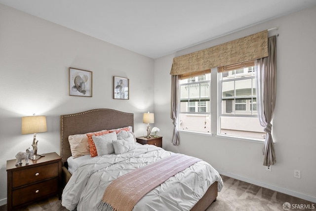 carpeted bedroom with baseboards