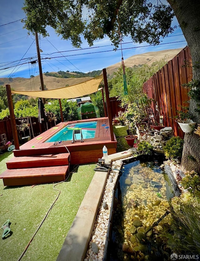 38002 Stenhammer Dr, Fremont, CA 94536 - view of pool featuring a wooden deck and a fenced backyard