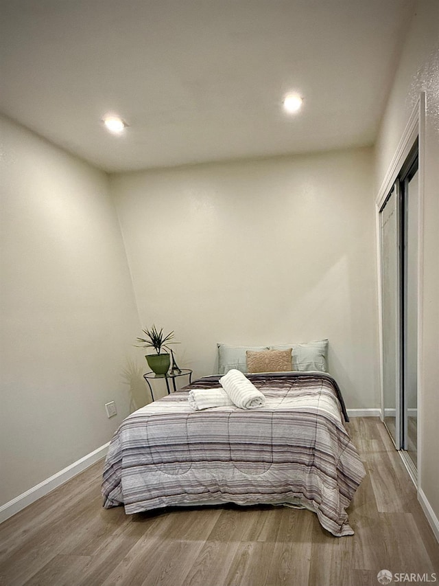 38002 Stenhammer Dr, Fremont, CA 94536 - bedroom featuring wood finished floors, baseboards, recessed lighting, and a closet