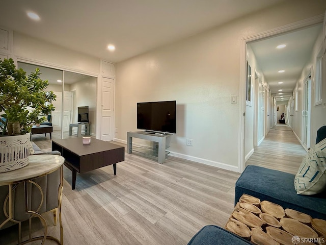 38002 Stenhammer Dr, Fremont, CA 94536 - living room with light wood finished floors, recessed lighting, and baseboards