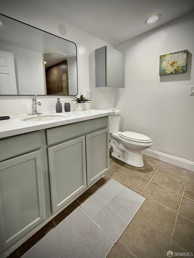 38002 Stenhammer Dr, Fremont, CA 94536 - bathroom featuring double vanity, toilet, baseboards, and recessed lighting