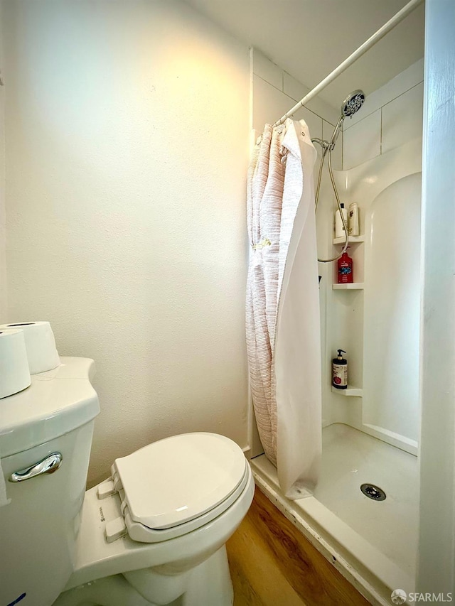 38002 Stenhammer Dr, Fremont, CA 94536 - bathroom featuring toilet, a stall shower, and wood finished floors