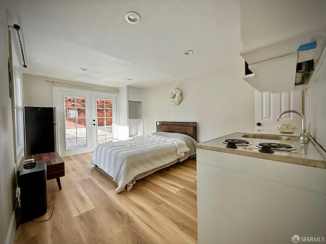 38002 Stenhammer Dr, Fremont, CA 94536 - bedroom featuring french doors, access to exterior, light wood finished floors, a sink, and recessed lighting