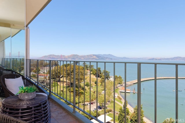 balcony with a water and mountain view