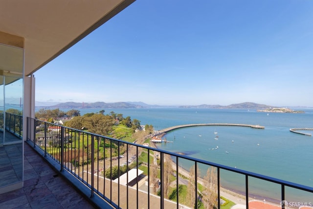 balcony with a water and mountain view