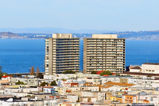 view of property featuring a water and mountain view