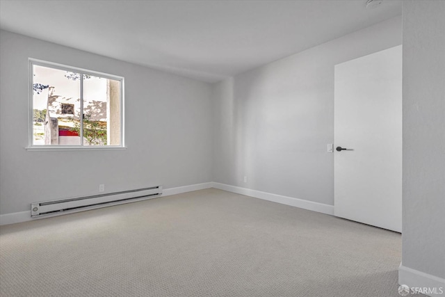 carpeted spare room with baseboard heating