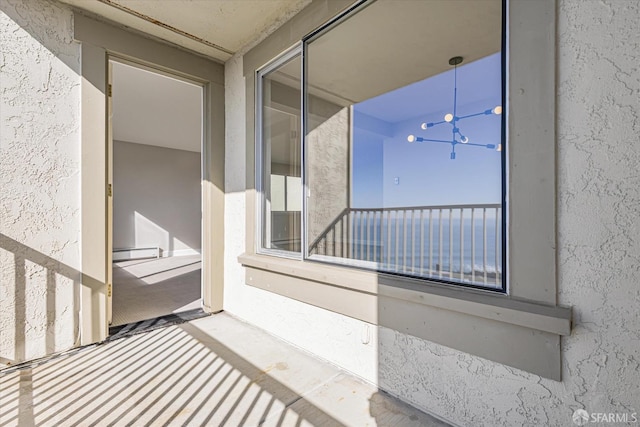 balcony featuring a baseboard radiator