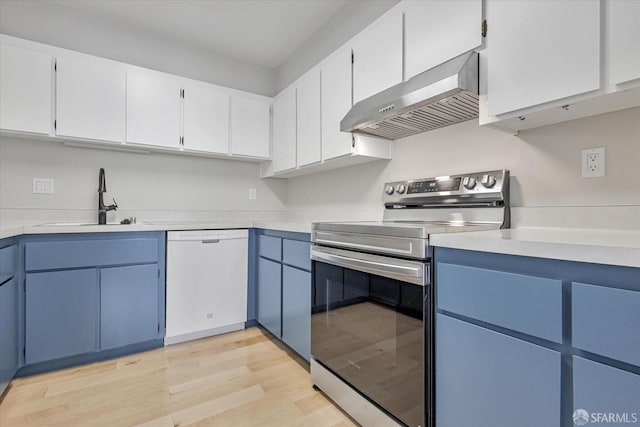 kitchen featuring white cabinetry, electric stove, white dishwasher, wall chimney exhaust hood, and sink