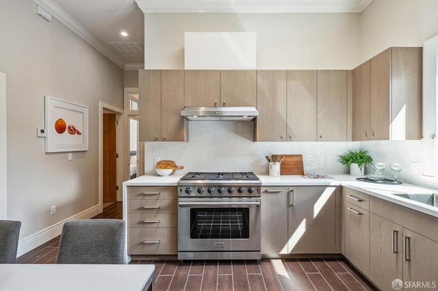 kitchen featuring crown molding, light brown cabinetry, dark hardwood / wood-style flooring, and stainless steel range